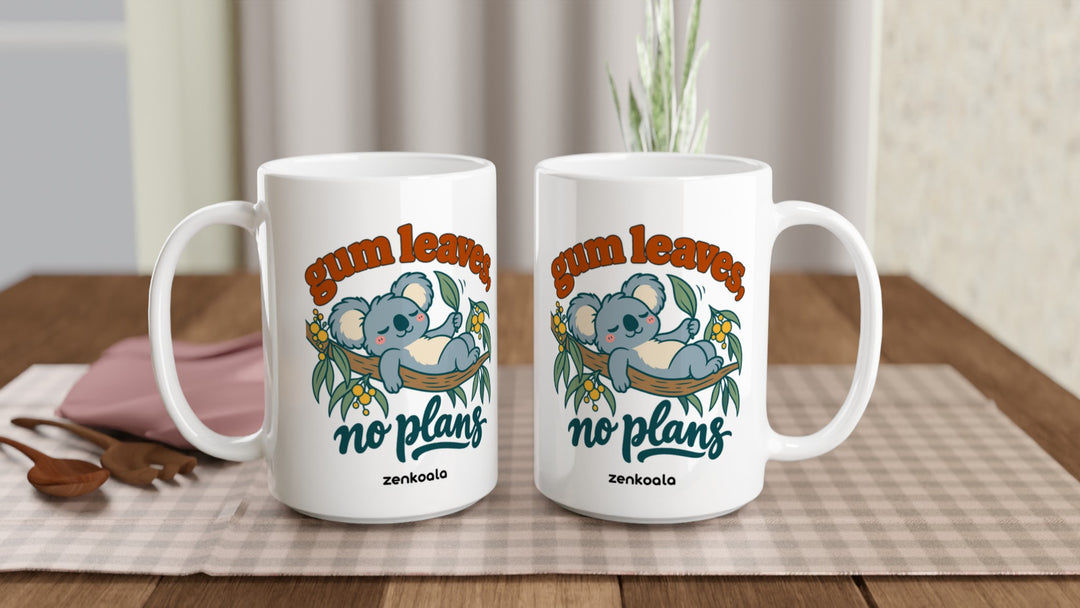 Two Gum Leaves No Plans 15oz mugs on a table, showing both sides of the design, Zen Koala Australia