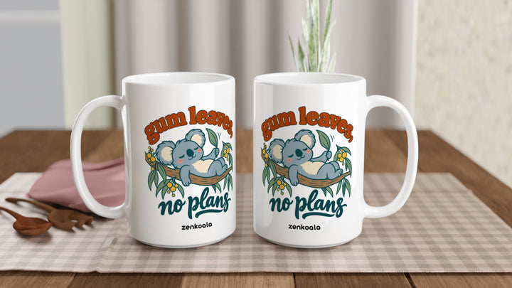 Two Gum Leaves No Plans 15oz mugs on a table, showing both sides of the design, Zen Koala Australia
