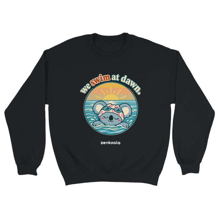 We Swim at Dawn feel-good sweatshirt in black: a koala swimming at sunrise, Zen Koala Australia