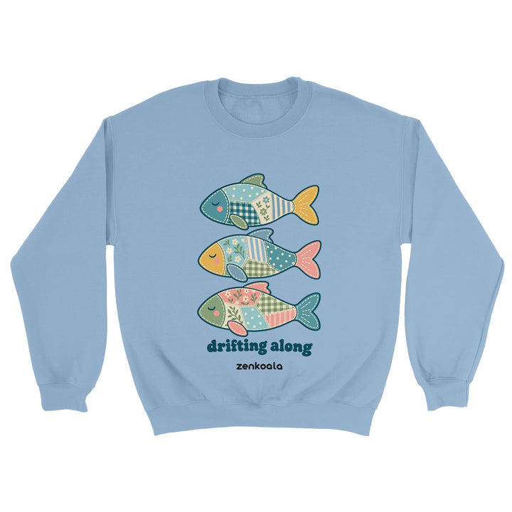 Drifting Along Fish feel-good sweatshirt in light blue: three faux patchwork fish drifting in a line, Zen Koala Australia