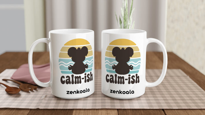 Two Calm-ish Retro Sunset Koala 15oz mugs on a table, showing both sides of the design, Zen Koala Australia