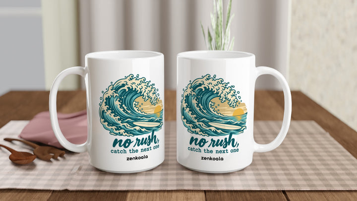 Two No Rush Catch the Next One 15oz mugs on a table, showing both sides of the design, Zen Koala Australia