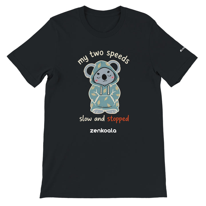 My Two Speeds Slow and Stopped feel-good tee in black — a sleepy koala in a cosy leaf-print hoodie, Zen Koala Australia