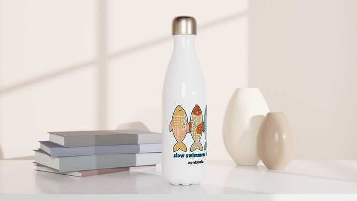 Slow Swimmers Club water bottle beside books and vases, Zen Koala Australia