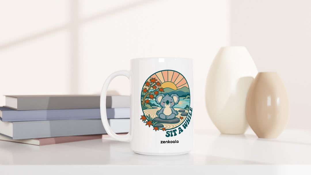 Sit a While 15oz mug beside books and vases, Zen Koala Australia
