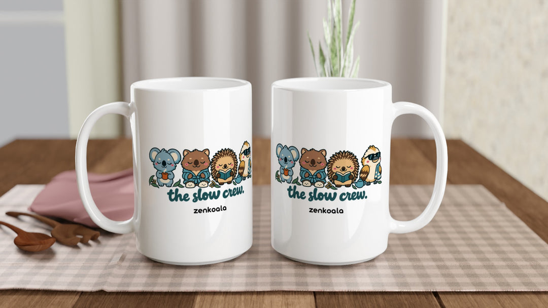 Two The Slow Crew 15oz mugs on a table, showing both sides of the design, Zen Koala Australia