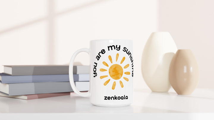 You Are My Sunshine 15oz mug beside books and vases, Zen Koala Australia