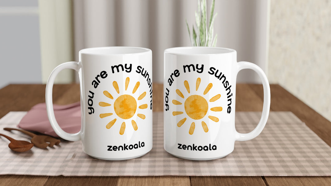 Two You Are My Sunshine 15oz mugs on a table, showing both sides of the design, Zen Koala Australia