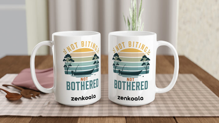 Two Not Biting Not Bothered 15oz mugs on a table, showing both sides of the design, Zen Koala Australia