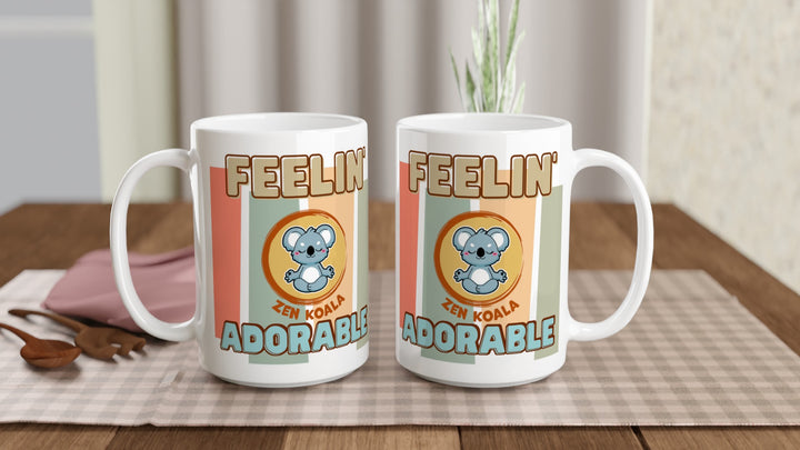 Two Feeling Adorable 15oz mugs on a table, showing both sides of the design, Zen Koala Australia