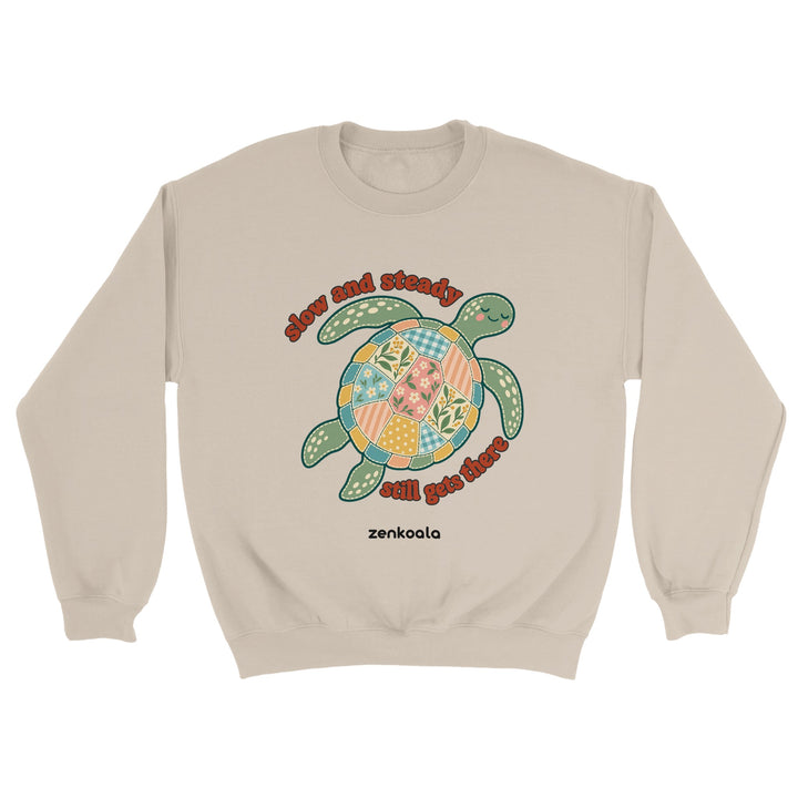 Slow and Steady Turtle feel-good sweatshirt in sand: a faux patchwork sea turtle, Zen Koala Australia