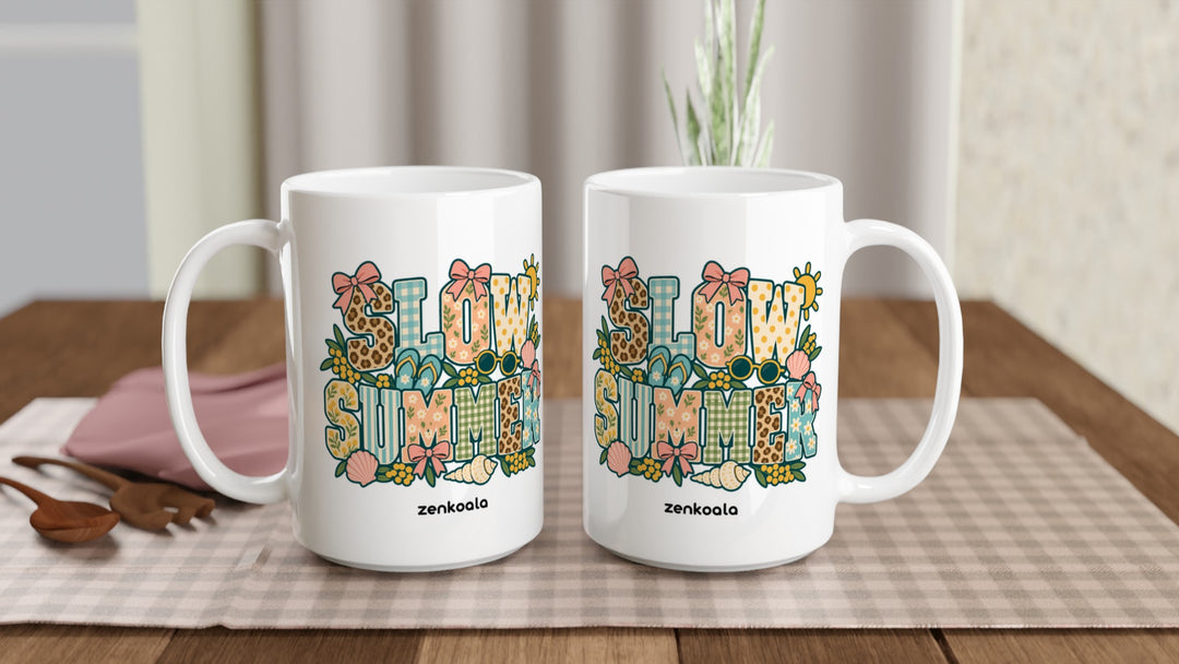 Two Slow Summer 15oz mugs on a table, showing both sides of the design, Zen Koala Australia