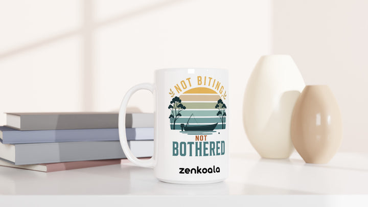 Not Biting Not Bothered 15oz mug beside books and vases, Zen Koala Australia