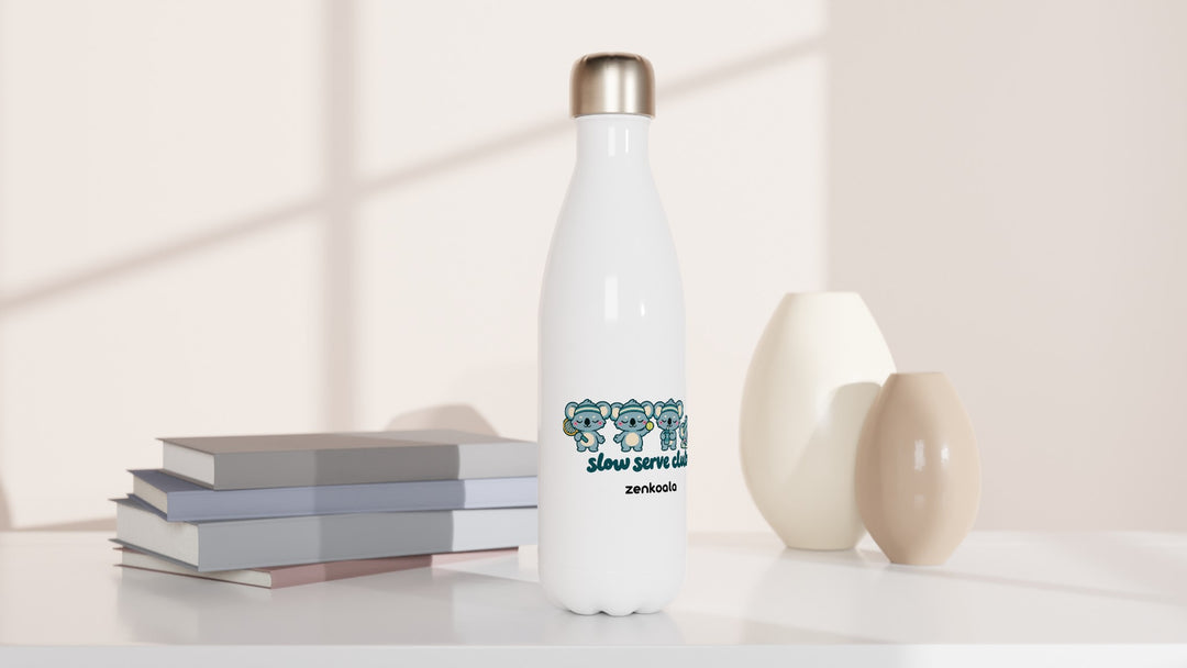 Slow Serve Club water bottle beside books and vases, Zen Koala Australia