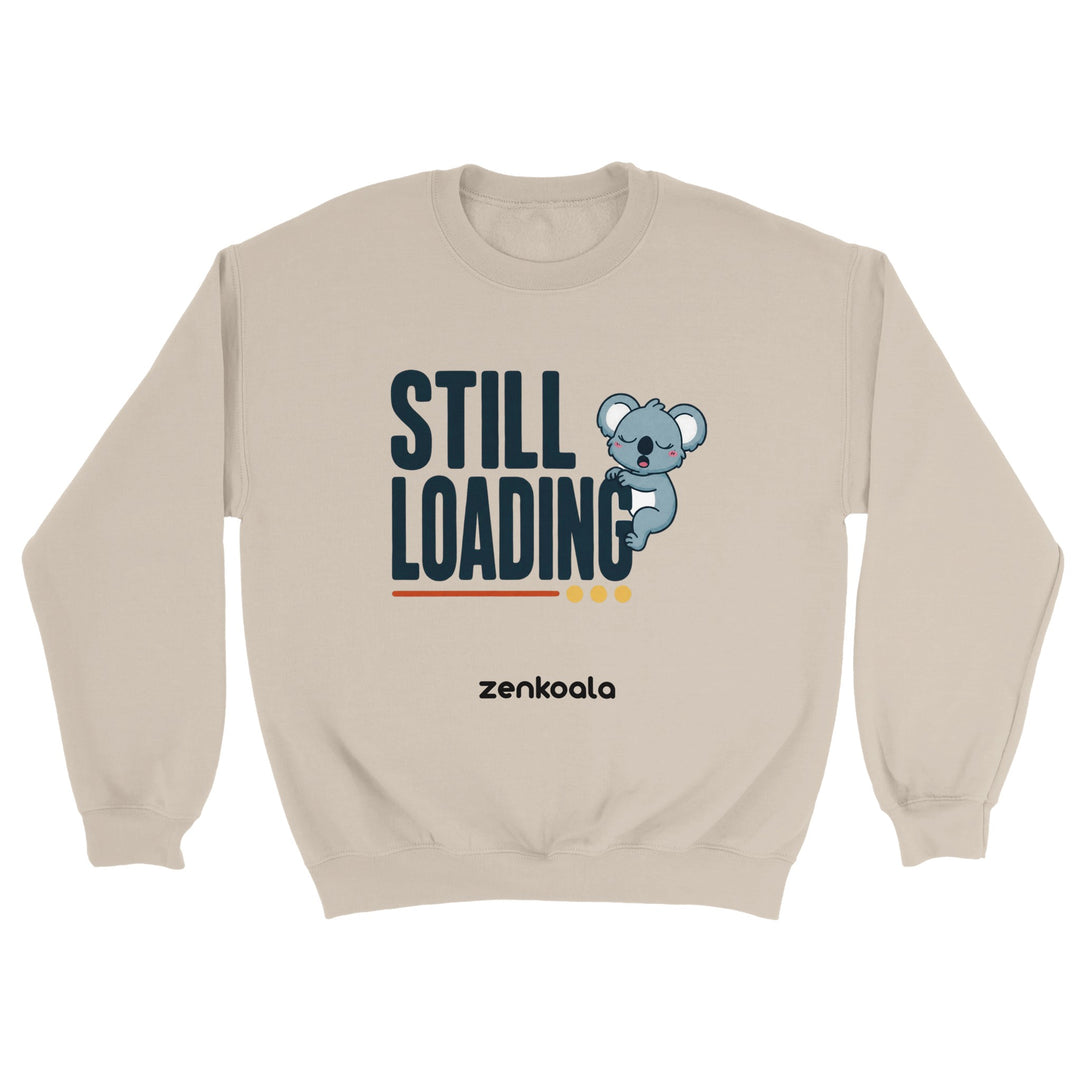 Still Loading Koala feel-good sweatshirt in sand — a sleepy yawning koala hanging off bold retro letters, Zen Koala Australia