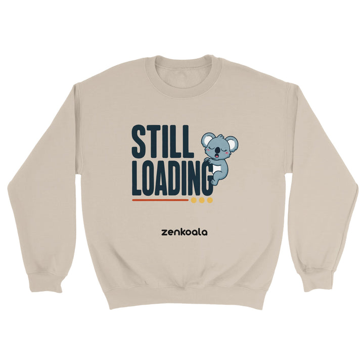 Still Loading Koala feel-good sweatshirt in sand — a sleepy yawning koala hanging off bold retro letters, Zen Koala Australia