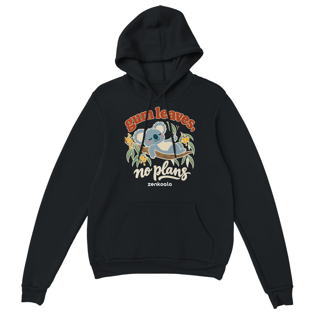 Gum Leaves No Plans feel-good hoodie in black: a koala lazing on a gum branch among wattle, Zen Koala Australia