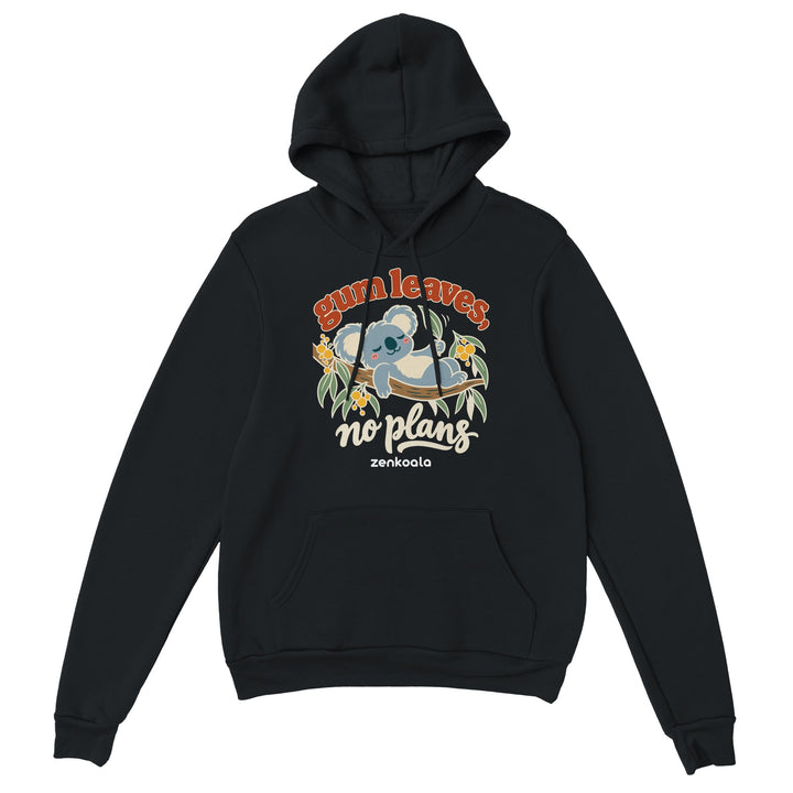 Gum Leaves No Plans feel-good hoodie in black: a koala lazing on a gum branch among wattle, Zen Koala Australia