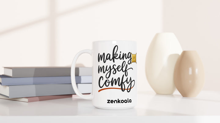 Making Myself Comfy 15oz mug beside books and vases, Zen Koala Australia