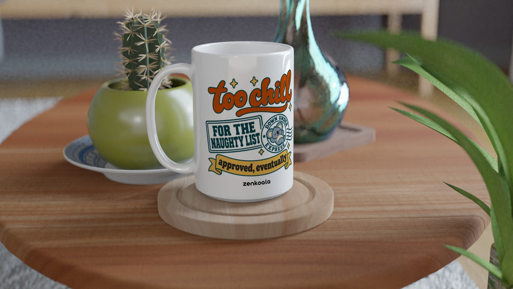 Too Chill for the Naughty List 15oz mug on a wooden table with a cactus, Zen Koala Australia