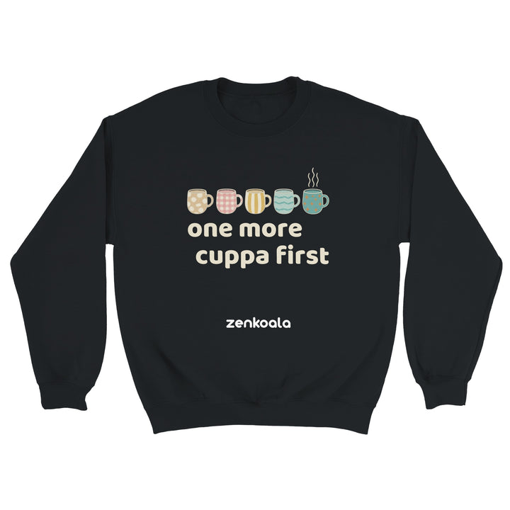 One More Cuppa First feel-good sweatshirt in black — five cosy patterned mugs, Zen Koala Australia