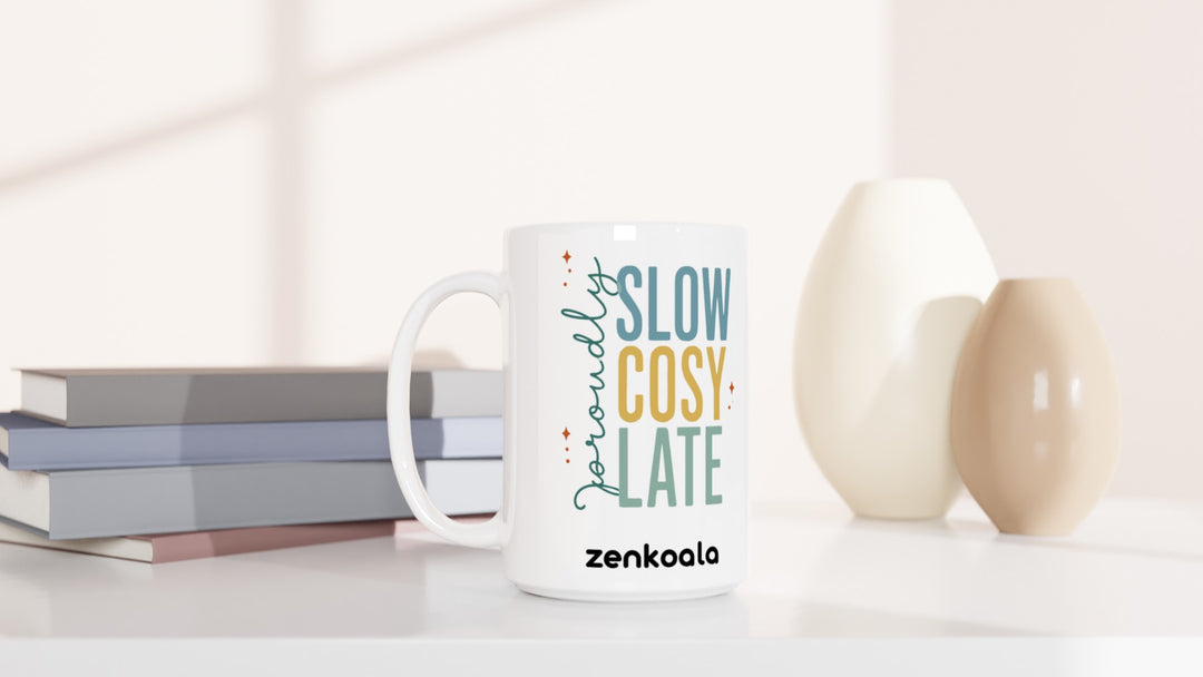 Proudly Slow Cosy Late 15oz mug beside books and vases, Zen Koala Australia