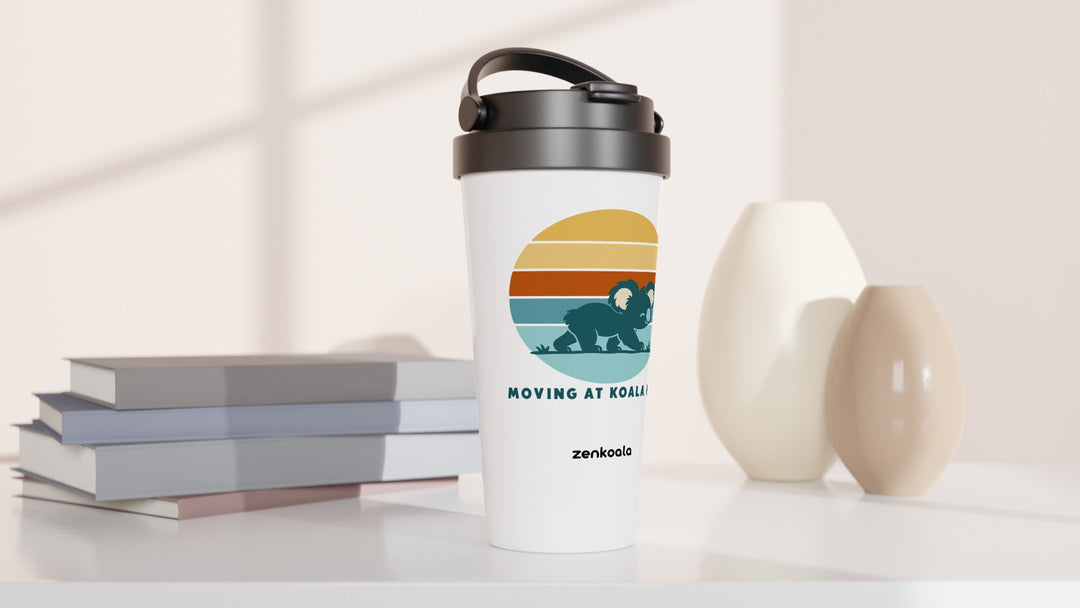 Moving at Koala Pace travel mug beside books and vases, Zen Koala Australia