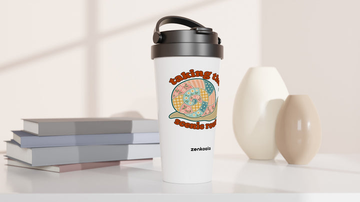 Taking the Scenic Route Snail travel mug beside books and vases, Zen Koala Australia