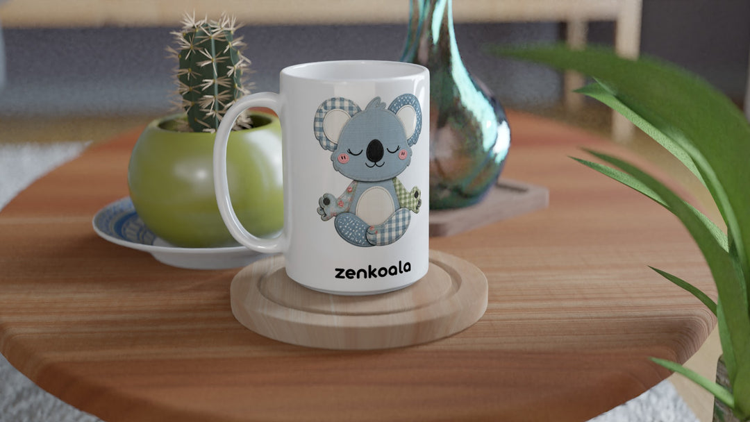 Faux Patchwork Meditating Koala 15oz mug on a wooden table with a cactus, Zen Koala Australia