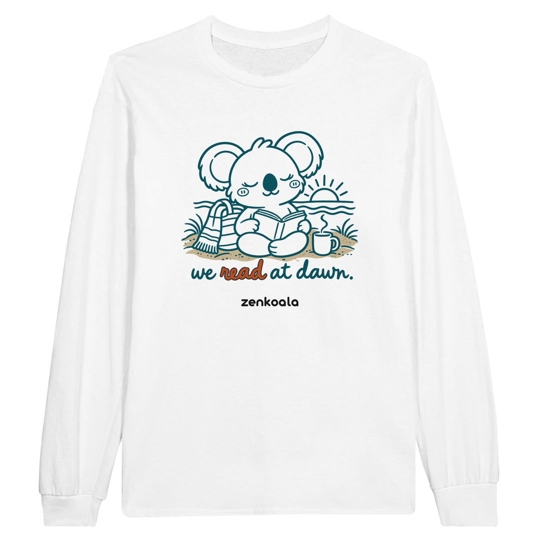 We Read at Dawn feel-good long sleeve tee in white: a koala reading on the beach, Zen Koala Australia