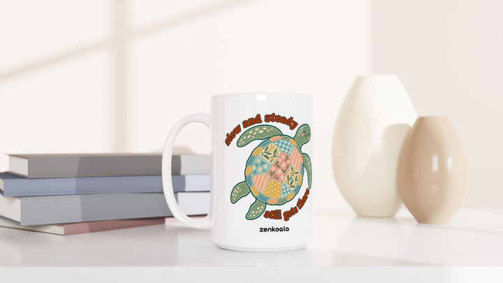 Slow and Steady Turtle 15oz mug beside books and vases, Zen Koala Australia