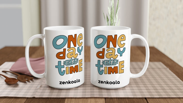 Two One Day at a Time 15oz mugs on a table, showing both sides of the design, Zen Koala Australia