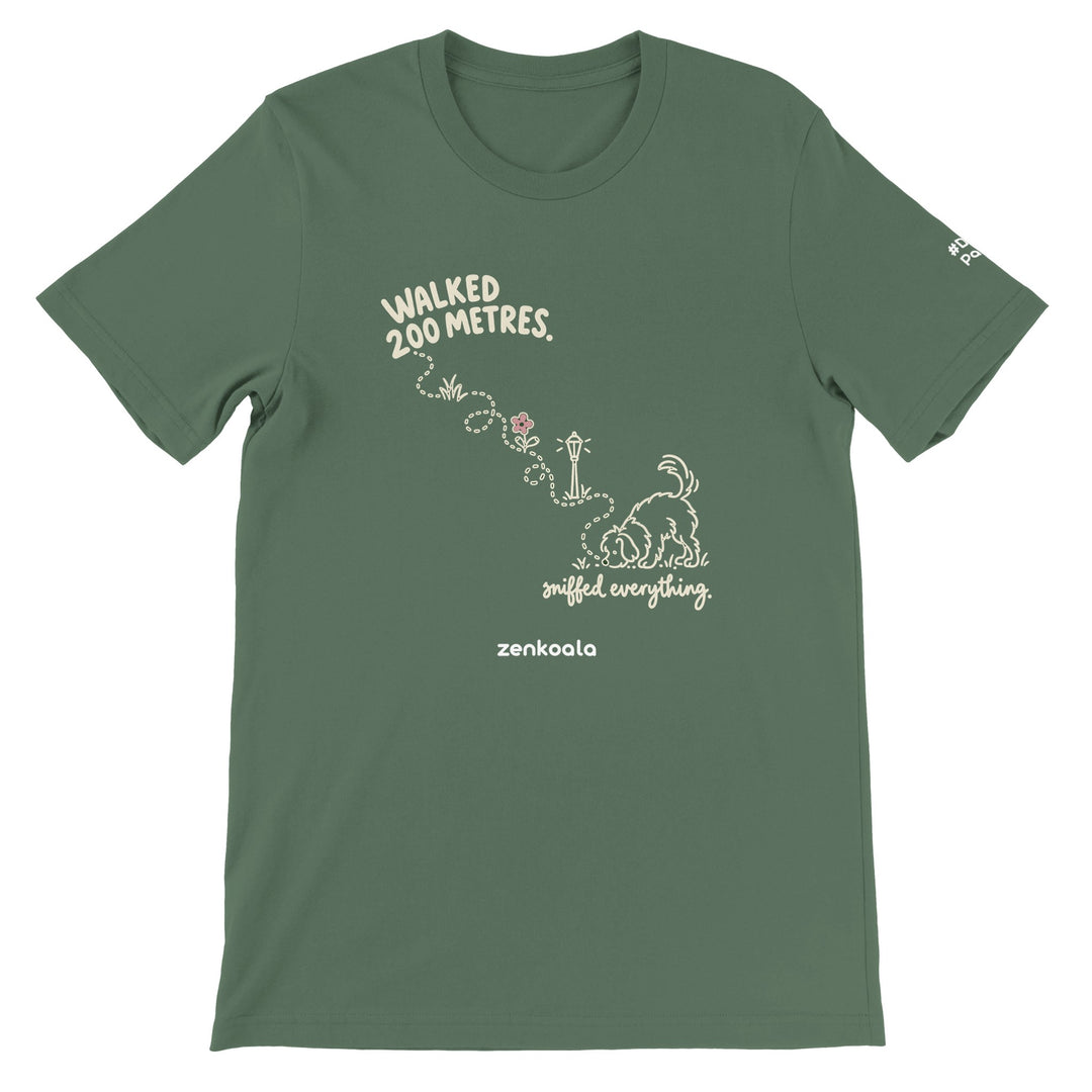 Sniffed Everything feel-good tee in military green: a little dog on a winding walk, Zen Koala Australia