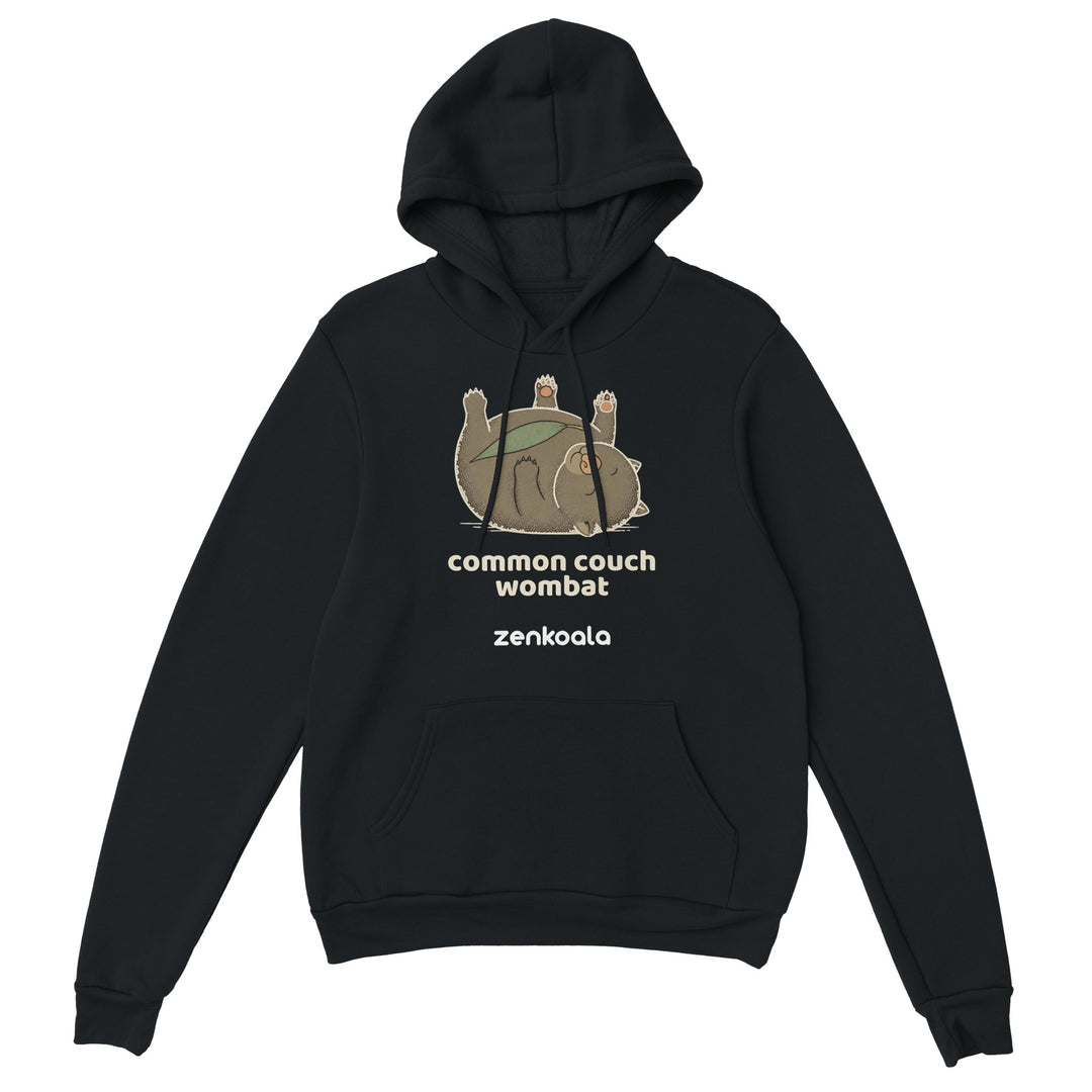 Common Couch Wombat feel-good hoodie in Black — a wombat flat out on its back with a gum leaf, Zen Koala Australia
