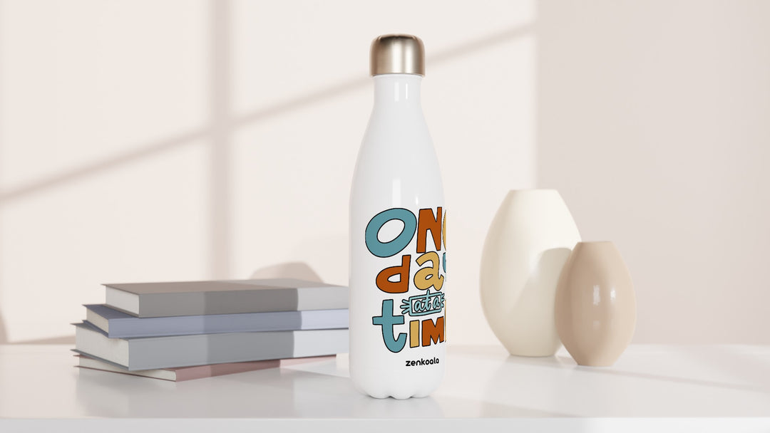 One Day at a Time water bottle beside books and vases, Zen Koala Australia