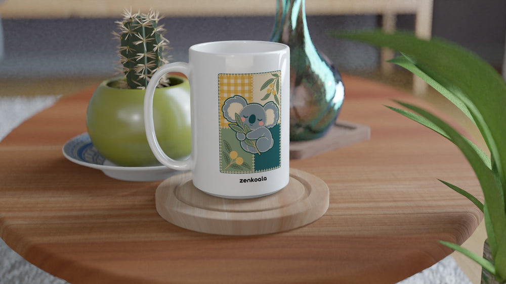 Koala Quilt 15oz mug on a wooden table with a cactus, Zen Koala Australia