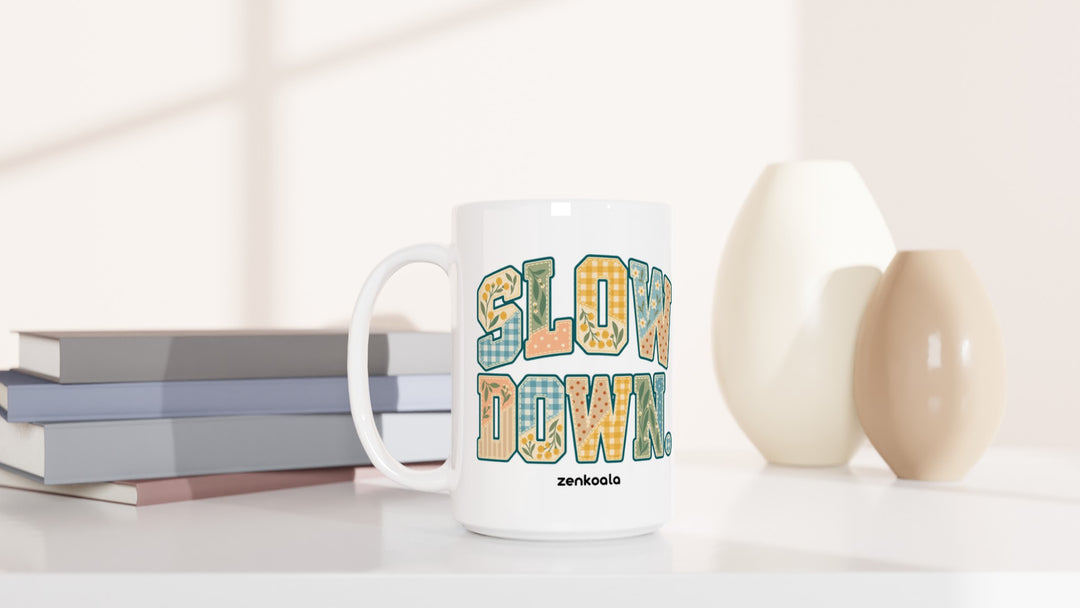 Slow Down Faux Patchwork 15oz mug beside books and vases, Zen Koala Australia