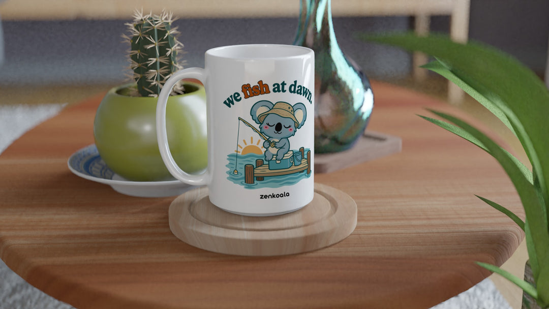 We Fish at Dawn 15oz mug on a wooden table with a cactus, Zen Koala Australia